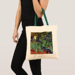Irises by Vincent van Gogh, Vintage Garden Art Tote Bag<br><div class="desc">Irises (1889) by Vincent van Gogh is a vintage fine art post impressionism landscape floral painting featuring a garden with purple bearded irises growing by orange poppies. A single white iris flower is blooming at the edge. About the artist: Vincent Willem van Gogh (1853 -1890) was one of the most...</div>