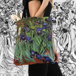 Irises by Vincent van Gogh, Vintage Garden Art Tote Bag<br><div class="desc">Beautiful all-over-print tote bags! Available in two styles and two sizes! Irises (1889) by Vincent van Gogh is a vintage fine art post impressionism landscape floral painting featuring a garden with purple bearded irises growing by orange poppies. A single white iris flower is blooming at the edge. About the artist:...</div>