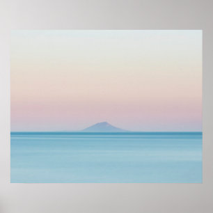 Island silhouette on horizon at sunset poster