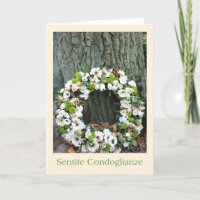 Italian Sympathy White flower wreath near tree