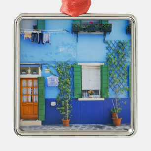 Italy, Burano. A colourful house in Burano near Metal Tree Decoration