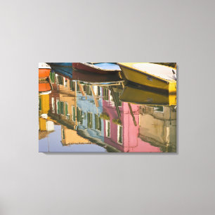 Italy, Burano. Boats on a canal with Canvas Print