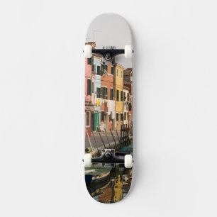 Italy, Burano. Colourful houses of line a Skateboard