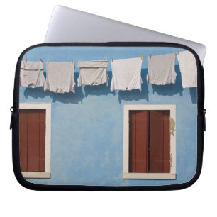 Italy, Burano. Hanging laundry and windows along Laptop Sleeve