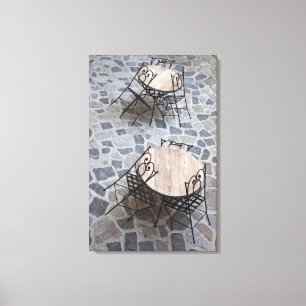 Italy, Sardinia, Castelsardo. Cafe tables. Canvas Print