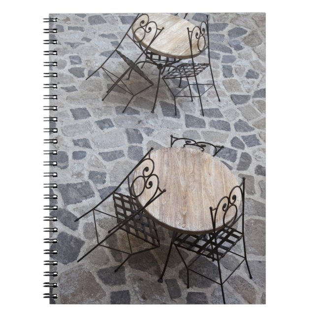 Italy, Sardinia, Castelsardo. Cafe tables. Spiral Notebook (Front)