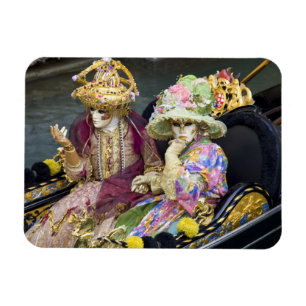 Italy, Venice. Couple dressed in costumes for Magnet