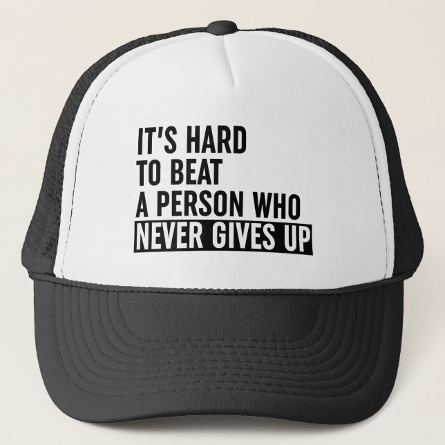 It's Hard To Beat A Person Who Never Gives Up Trucker Hat (Front)