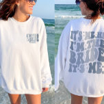 It's Me Hi I'm the Bride Its Me Cool Personalised Sweatshirt<br><div class="desc">Embrace the cool vibes of your bachelorette party with our "It's Me Hi I'm the Bride" Cool Personalised Sweatshirt. Designed for a trendy and groovy bachelorette theme, this sweatshirt is perfect for the bride who wants to make a statement. Featuring a front and back print with retro wavy text and...</div>