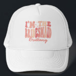 It's Me Hi I'm the Bridesmaid It's Me Personalised Trucker Hat<br><div class="desc">Presenting our "It's Me Hi I'm the Bridesmaid" Personalised Trucker Hat – a fabulous addition to your bridesmaid squad ensemble. This trendy and cute peach coral pink hat is more than just a headpiece; it's a stylish expression of your role in the bridal party. Featuring a retro wavy text with...</div>