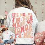 Its Me Hi Im the Maid Of Honour Its Me Personalise<br><div class="desc">Introducing the "It's Me Hi I'm the Maid of Honour" Personalised Sweatshirt – a trendy and cute peach coral pink garment that adds a touch of fun and style to your Maid of Honour's wardrobe. This cool bachelorette party shirt features a front and back print with retro wavy text, making...</div>