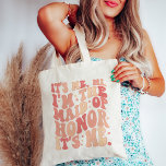 Its Me Hi Im the Maid Of Honour Its Me Personalise Tote Bag<br><div class="desc">Introducing the "It's Me Hi I'm the Maid of Honour" Personalised Tote Bag – the perfect blend of style and functionality for your esteemed Maid of Honour. This trendy and cute peach coral pink tote bag is not just an accessory; it's a statement piece that reflects the importance of your...</div>