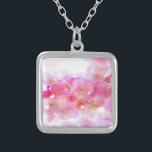 Japanese Cherry Tree with Pastel Pink Blossoms Silver Plated Necklace<br><div class="desc">Springtime fresh floral image. Fancy Japanese cherry tree blossoms in soft delicate pinks and gentle whites. Some bright pink and luminous yellow coloured swirls and twinkling lights surround these blossoms giving it a magical dreamy effect, like something from a fairy universe. Faded handwritten text in french gives it a romantic...</div>