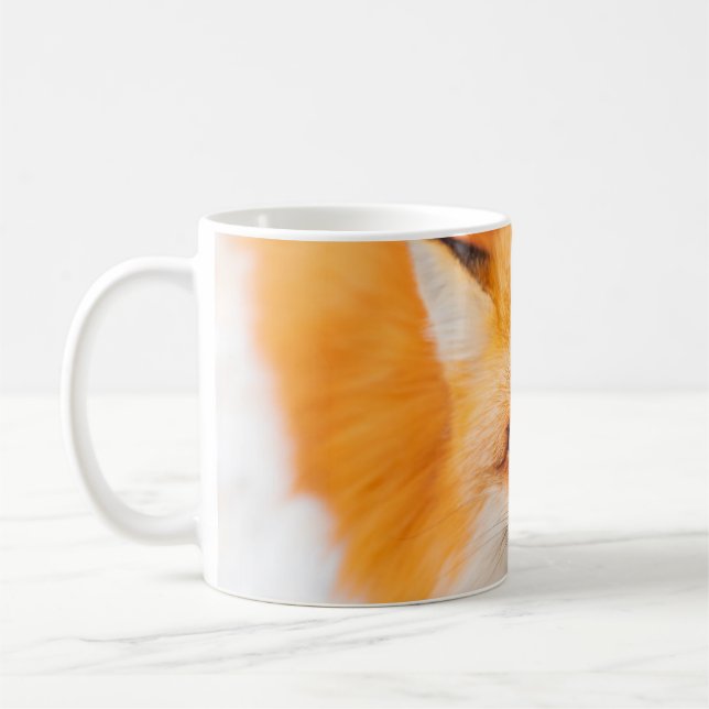 Japanese red fox resting, sleeping and playing in  coffee mug (Left)