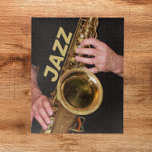 Jazzman Playing Gold Saxophone Jigsaw Puzzle<br><div class="desc">For jazz music fans! A challenging jigsaw puzzle that features the photo image of a jazzman playing his time-worn,  gold coloured,  tenor saxophone horn along with the word "JAZZ" printed in gold coloured block letters. Fun for the whole family! NOTE: Image not designed for square puzzle style.</div>