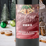 Jingling Bells Red Winter Wonderland Christmas  Wine Label<br><div class="desc">Add a touch of elegance and festive cheer to your holiday celebrations with our customisable Christmas wine bottle label. The design features an abstract vibrant red backdrop, adorned with decorative jingling bells, snowflakes and twinkling lights, embodying the spirit of the season. The cursive font that reads ‘Merry Christmas’ adds a...</div>