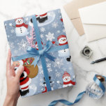 Jolly Santa Claus and Snowmen Christmas Pattern Wrapping Paper<br><div class="desc">Bring the festive cheer to your holiday decor with this delightful Christmas pattern featuring a jolly Santa Claus carrying a sack full of gifts and adorable snowmen in cosy winter scarves and hats. Set against a whimsical backdrop of snowflakes, this design captures the magic of the holiday season and adds...</div>
