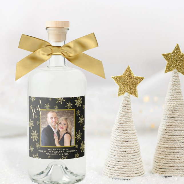 Joy! Gold & Black Holiday Photo Festive Snowflakes Liquor Bottle Label (In Situ with Bow & Decor)