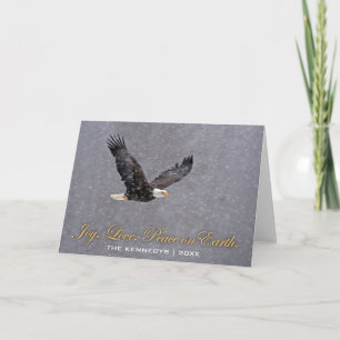 Joy Love Peace - Bald eagle flying in snowstorm Holiday Card