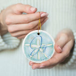 Joy Watercolor Ocean Sand Dollar Seashell Photo Ceramic Tree Decoration<br><div class="desc">Who needs snowflakes when you have seashells! Capture a cool nautical casual and coastal vibe this holiday sea-son with our coastal seaside-inspired holiday Christmas collection. We've hand-painted a beautiful watercolor ocean sand dollar seashell in light turquoise and coastal blue to create a calm coastal vibe to shellabrate the holiday season....</div>