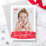 Joyful Brushstroke Holiday Photo Card<br><div class="desc">A modern holiday card featuring a festive red brushstroke and joyful script. The backer includes a snowy pattern with the option to remove and swap with a personalised message or additional photos.</div>