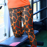 Jungle Giraffe Print<br><div class="desc">These leggings are beautifully designed with a mesmerising orange and black giraffe spots pattern, offering a unique and stylish addition to your wardrobe. The pattern showcases the distinctive and elegant spots that are characteristic of giraffes, creating a sophisticated and eye-catching look. The leggings are made from high-quality and stretchy fabric,...</div>