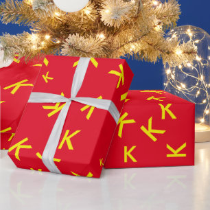 K custom letter - yellow name-initial on red wrapping paper