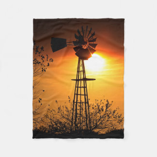 Kansas Golden Sunset with a Windmill silhouette Fleece Blanket