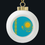 Kazakhstan Flag Ceramic Ball Christmas Ornament<br><div class="desc">The Kazakhstan flag is a blue field with in the centre a sun and an eagle and on the a national ornamental pattern. The used colours in the flag are blue, yellow. The proportion of the Kazakhstan flag is 1:2. The Flag of Kazakhstan was adopted in 1992. The first use...</div>