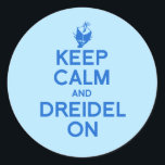 KEEP CALM AND DREIDEL ON CLASSIC ROUND STICKER<br><div class="desc">Happy Holigays! Shop Holiday Humour, LGBTQ Designs and Funny Christmas Gifts From LGBTShirts.com Shop for Everyone and Browse over 10, 000 LGBTQ Gifts, Holiday Humour, Equality, Slang, & Culture Designs. The Most Unique Gay, Lesbian Bi, Trans, Queer, and Intersexed Apparel on the web. SHOP MORE LGBTQ Designs and Gifts at:...</div>