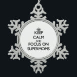 Keep Calm and focus on Supermoms Snowflake Pewter Christmas Ornament<br><div class="desc">Use the search tool at my store to find other Supermoms merchandise. Keep Calm and focus on Supermoms products available on tshirts, sweatshirts, kids shirts, infant onsies, stickers, magnets, and much more Supermoms clothing fully customisable to your specifications. If you like what you see, please link to my store (www.zazzle.com/thisandthatgifts)...</div>