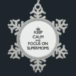 Keep Calm and focus on Supermoms Snowflake Pewter Christmas Ornament<br><div class="desc">Use the search tool at my store to find other Supermoms merchandise. Keep Calm and focus on Supermoms products available on tshirts, sweatshirts, kids shirts, infant onsies, stickers, magnets, and much more Supermoms clothing fully customisable to your specifications. If you like what you see, please link to my store (www.zazzle.com/thisandthatgifts)...</div>