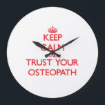 Keep Calm and Trust Your Osteopath Large Clock<br><div class="desc">Use the search tool at my store to find other Osteopath merchandise. Keep Calm and Trust Your Osteopath products available on tshirts, sweatshirts, kids shirts, infant onsies, stickers, magnets, and much more Osteopath clothing fully customisable to your specifications. If you like what you see, please link to my store (www.zazzle.com/jobgifts)...</div>