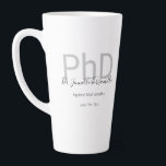 Keepsake Black Grey Name PhD Graduation Latte Mug<br><div class="desc">A PhD graduation latte mug that features the graduate’s name, field of study, and graduation date. The mug includes the name in a handwriting script font and a black and grey design. It’s great as a keepsake or a party favour. Simply add the graduate’s info, add this mug to your...</div>