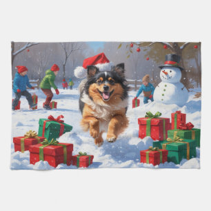 Keeshond Dog Running in Snow with Christmas Hat Tea Towel
