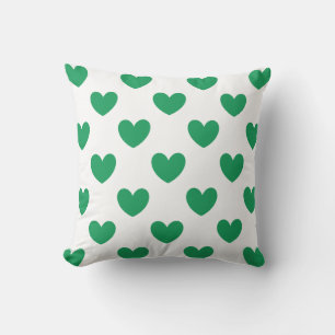 Kelly green polka hearts on white cushion