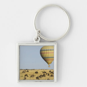 Kenya, Masai Mara. Tourists ride hot air balloon Key Ring