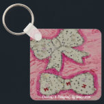 Keychain<br><div class="desc">Sara’s art collection was inspired by her mother’s creativity and talent for choosing the perfect bow for every occasion and mood. Through her piece,  Sara celebrates that special influence with style,  color,  and self-expression.</div>