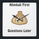 Khinkali Square Wall Clock<br><div class="desc">Khinkali is a traditional Georgian dish that has become a symbol of Georgian hospitality. These large, hand-crafted dumplings are filled with a savory mixture of minced meat (usually beef and pork), herbs, and spices. The dough is carefully wrapped around the filling, creating a beautiful knot at the top, which also...</div>