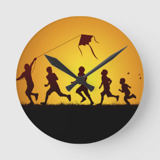 Kids flying a kite round clock