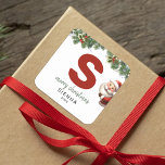 Kids Monogram Christmas Square Sticker<br><div class="desc">Give the gift of personalised charm this Christmas! Our monogram stickers,  featuring Santa hiding behind the letter S,  are a unique and thoughtful way to show your love. Customise with a name,  year and a heartfelt greeting. Make your Christmas gifts stand out!</div>