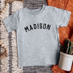 Kids Personalised Name Tee<br><div class="desc">These personalised children's t-shirts feature your child's name or other custom text in a stylish, modern arched font, adding a playful and unique touch to their wardrobe. Made from soft, high-quality fabric, these custom tees are perfect for everyday wear, special occasions, or as a thoughtful gift. Let your little one...</div>