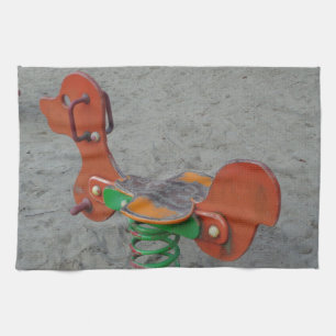 Kids Playground Orange Dog Toy in Sand Tea Towel