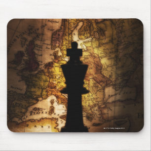 King chess piece on old world map mouse pad