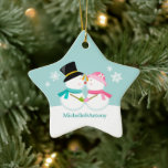 Kissing Snowmen Christmas Ceramic Tree Decoration<br><div class="desc">Custom Christmas ornament featuring an adorable and unique vector illustration  of a couple of snowmen kissing in the snow on a winter blue background. Personalise it with your names,  wedding anniversary date,  or any text of your choice to make the perfect First Christmas  or couple ornament keepsake.
  ©Sanqunetti Design</div>