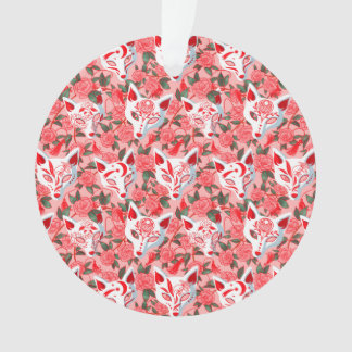 Kitsune masks and blooming camellia on pink ornament