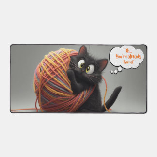 Kitten playing in yarn desk mat
