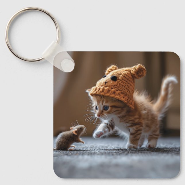 Kitten playing with a small mouse key ring (Front)