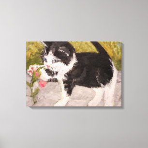 Kitten Playing with Pink Flower Canvas Print