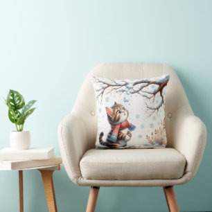 Kitten Watching Falling Snow from Branch Cushion